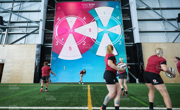 131023 - Wales Women Conditioning Session - The Wales team take kicks and passes against a giant interactive video wall during a skills and conditioning session on Wales’ first full day in Wellington, New Zealand ahead of the start of WXV1