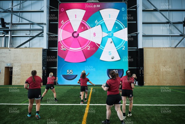 131023 - Wales Women Conditioning Session - The Wales team take kicks and passes against a giant interactive video wall during a skills and conditioning session on Wales’ first full day in Wellington, New Zealand ahead of the start of WXV1