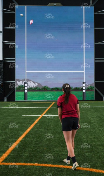 131023 - Wales Women Conditioning Session - Nel Metcalfe takes a kick against a giant interactive video wall during a skills and conditioning session on Wales’ first full day in Wellington, New Zealand ahead of the start of WXV1
