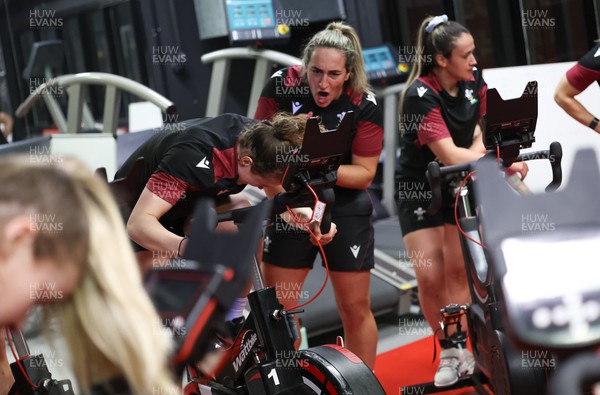 120324 - Wales Women Bike session -  Courtney Keight encourages Jenny Hesketh during a bike session ahead of the start of the Women’s 6 Nations
