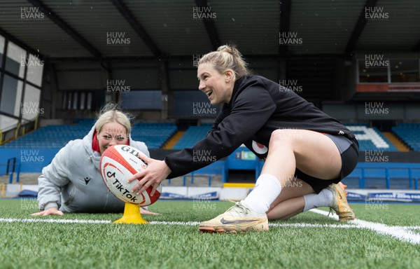 140423 - Wales Women Rugby Kickers Practice - Keira Bevan, with assistance from Kelsey Jones, during kickers practice at Cardiff Arms Park ahead of the TicTok Women’s 6 Nations match against England tomorrow