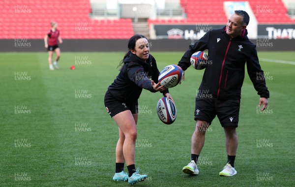 290324 - Wales Women Rugby Kickers Session - Sian Jones with Shaun Connor, Wales Women attack coach, during a kickers session at Ashton Gate ahead of the Guinness Women’s 6 Nations match against England
