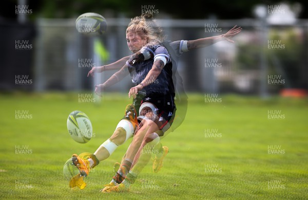 271022 - Wales Women Rugby Training Session - A multiple exposure shot of Keira Bevan of Wales as she goes through kicking practice ahead of the Women’s Rugby World Cup Quarter Final against New Zealand NB - Editors note, image created with additional software