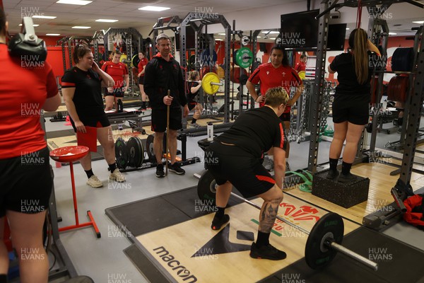 080222 - Behind the Scenes in the Wales Women Rugby Camp as they prepare for this years 6 Nations Championship - Coach Eifion Roberts advises during the gym session 