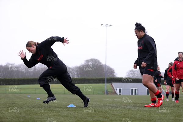 220222 - Behind the scenes with the Wales Women National Rugby team at the National Centre of Excellence at the Vale Resort Hotel - Alisha Butchers and Sisilia Tuipulotu during training