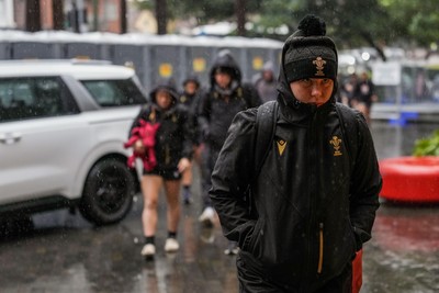 310725 - Wales Women Rugby Captain’s Run - Players and management  arrive in the rain for Wales’ Captain’s Run ahead of the second test against Australia