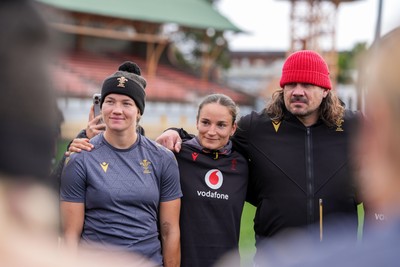 310725 - Wales Women Rugby Captain’s Run - Carys Cox, Jasmine Joyce and Dan Murphy, Wales Women defence coach, during Wales’ Captain’s Run ahead of the second test against Australia