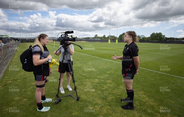 111022 - Wales Women Rugby Training Session - Wales’ Natalia John is interviewed by team mate Gwen Crabb after a training session ahead of their Women’s Rugby World Cup match against New Zealand