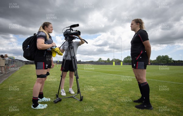 111022 - Wales Women Rugby Training Session - Wales’ Natalia John is interviewed by team mate Gwen Crabb after a training session ahead of their Women’s Rugby World Cup match against New Zealand