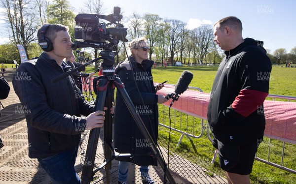 190424 - Wales Women Rugby Media session - Ioan Cunningham, Wales Women head coach, gives a media interview during a media session held at the Urdd WRU 7s ahead of Wales’ Guinness 6 Nations match against France