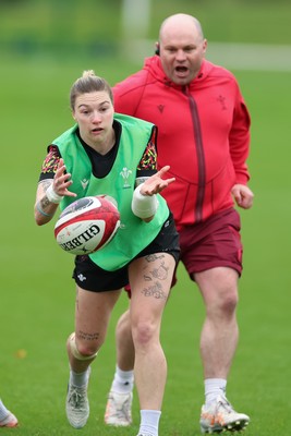 010426 - Wales Women Rugby Training Session - Keira Bevan with Sean Lynn, Wales Women head coach, during training ahead of the start of the Women’s 6 Nations