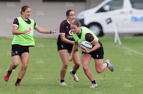 011123 - Wales Women Rugby Training Session - Carys Cox gets past Nel Metcalfe during a training session ahead of their final WXV1 match against Australia