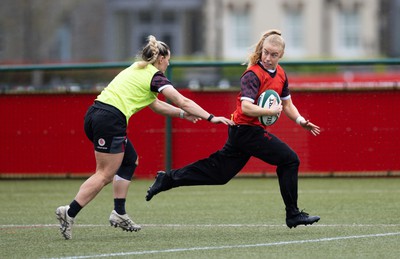 020424 - Wales Women’s Rugby Training Session - Catherine Richards gets past Kerin Lake during a training session ahead of Wales’ next Women’s 6 Nations match against Ireland