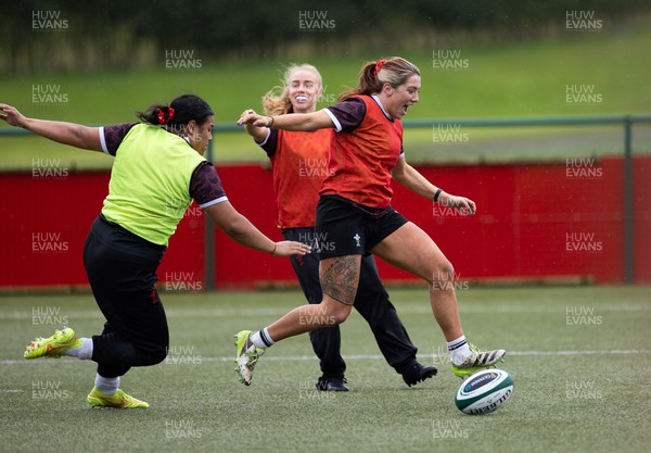 020424 - Wales Women’s Rugby Training Session - Georgia Evans with Sisilia Tuipulotu and Catherine Richards during a training session ahead of Wales’ next Women’s 6 Nations match against Ireland