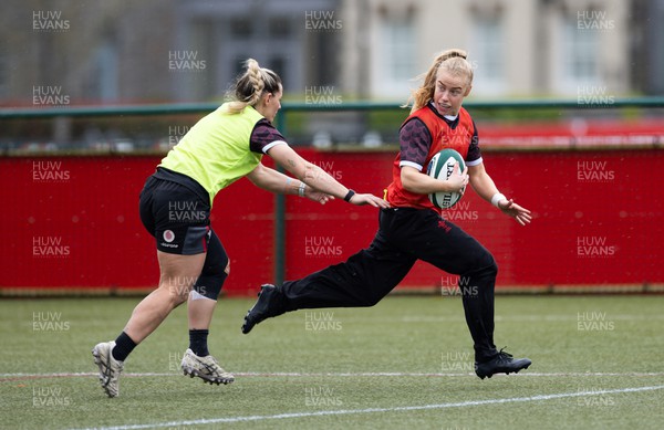 020424 - Wales Women’s Rugby Training Session - Catherine Richards gets past Kerin Lake during a training session ahead of Wales’ next Women’s 6 Nations match against Ireland