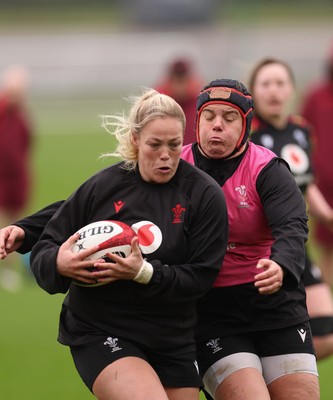 030426 - Wales Women Rugby Training session - Kelsey Jones is tackled by Carys Phillips during training ahead of the start of the Women’s 6 Nations
