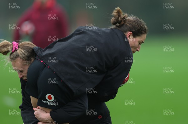 030426 - Wales Women Rugby Training session - Jasmine Joyce is tackled by Hannah Dallavalle during training ahead of the start of the Women’s 6 Nations