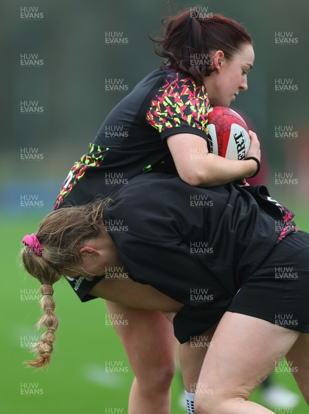 030426 - Wales Women Rugby Training session - Sian Jones is tackled by Hannah Dallavalle during training ahead of the start of the Women’s 6 Nations