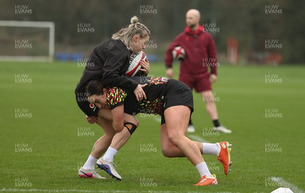 030426 - Wales Women Rugby Training session - Keira Bevan is tackled by Courtney Keight during training ahead of the start of the Women’s 6 Nations