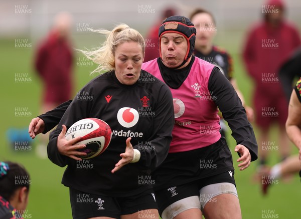 030426 - Wales Women Rugby Training session - Kelsey Jones is tackled by Carys Phillips during training ahead of the start of the Women’s 6 Nations