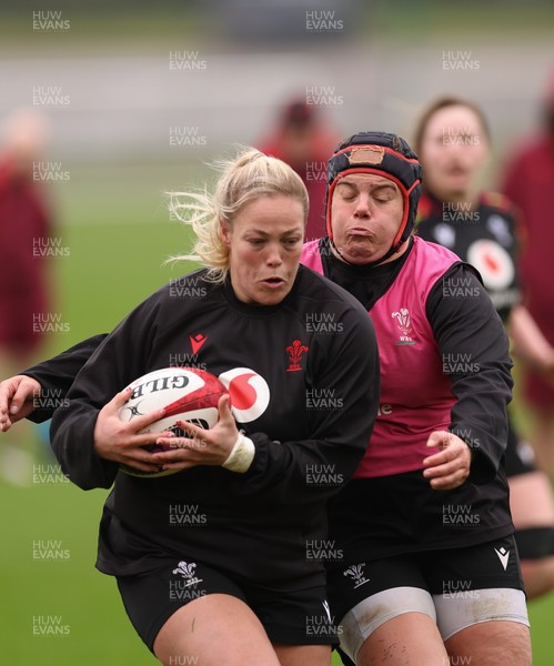 030426 - Wales Women Rugby Training session - Kelsey Jones is tackled by Carys Phillips during training ahead of the start of the Women’s 6 Nations