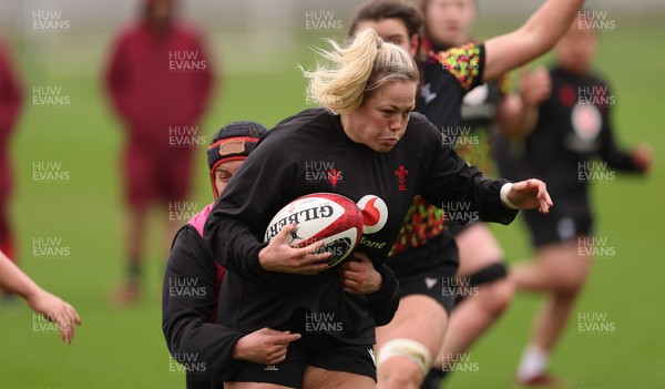 030426 - Wales Women Rugby Training session - Kelsey Jones is tackled by Carys Phillips during training ahead of the start of the Women’s 6 Nations