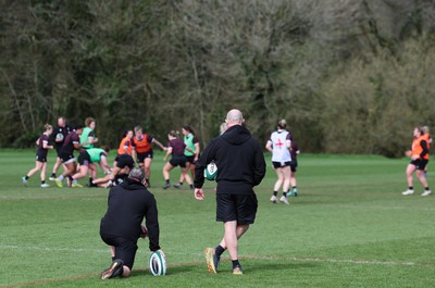 040424 - Wales Women’s Rugby Training Session - Shaun Connor, Wales Women attack coach, and Mike Hill, Wales Women forwards coach, watch the Wales Women’s squad during training session ahead of Wales’ next Women’s 6 Nations match against Ireland