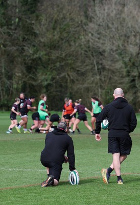 040424 - Wales Women’s Rugby Training Session - Shaun Connor, Wales Women attack coach, and Mike Hill, Wales Women forwards coach, watch the Wales Women’s squad during training session ahead of Wales’ next Women’s 6 Nations match against Ireland