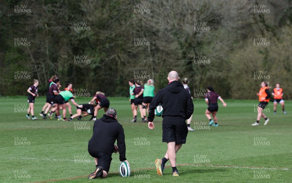 040424 - Wales Women’s Rugby Training Session - Shaun Connor, Wales Women attack coach, and Mike Hill, Wales Women forwards coach, watch the Wales Women’s squad during training session ahead of Wales’ next Women’s 6 Nations match against Ireland