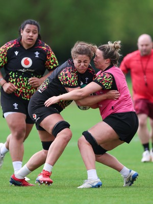 050526 - Wales Women Rugby Training Session - Natalia John is tackled by Alisha Joyce during training ahead of the 6 Nations match against Ireland