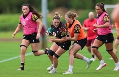 050526 - Wales Women Rugby Training Session - Alisha Joyce takes on Carys Cox during training ahead of the 6 Nations match against Ireland
