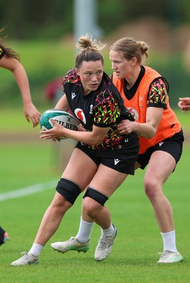 050526 - Wales Women Rugby Training Session - Alisha Joyce takes on Carys Cox during training ahead of the 6 Nations match against Ireland
