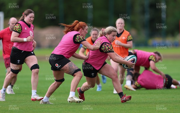050526 - Wales Women Rugby Training Session - Molly Reardon takes on Georgia Evans during training ahead of the 6 Nations match against Ireland