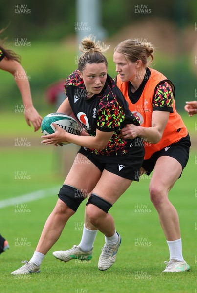 050526 - Wales Women Rugby Training Session - Alisha Joyce takes on Carys Cox during training ahead of the 6 Nations match against Ireland
