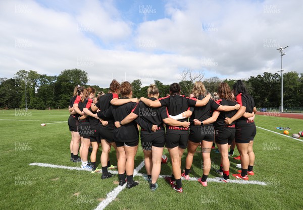 050722 - Wales Women Rugby Squad back in training as the road to the World Cup begins - Wales team huddle during training