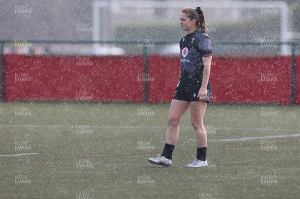 060423 -  Wales Women Rugby Squad - Lisa Neumann assess the rain during a training session ahead of their TicTok Women’s 6 Nations match against England