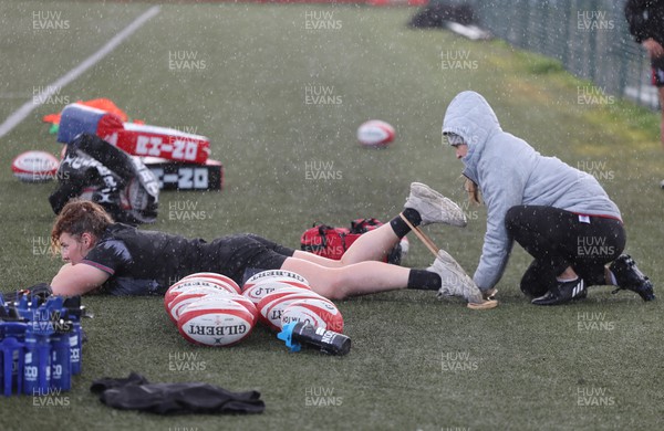 060423 -  Wales Women Rugby Squad - Medic Cara Jones works with Gwenllian Pyrs during a training session ahead of their TicTok Women’s 6 Nations match against England