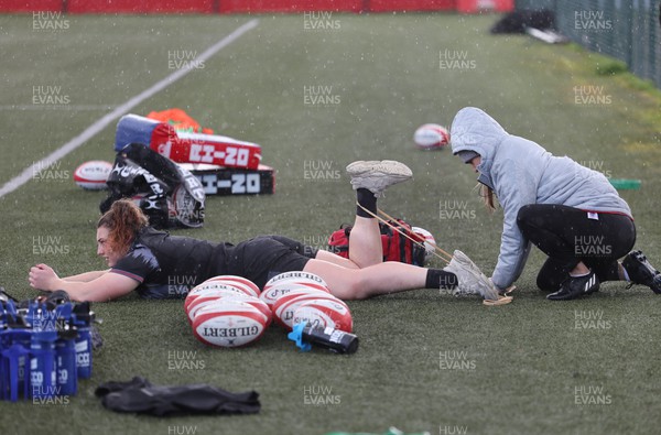 060423 -  Wales Women Rugby Squad - Medic Cara Jones works with Gwenllian Pyrs during a training session ahead of their TicTok Women’s 6 Nations match against England