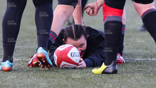 060423 -  Wales Women Rugby Squad - Charlie Munday lays the ball back during a training session ahead of their TicTok Women’s 6 Nations match against England
