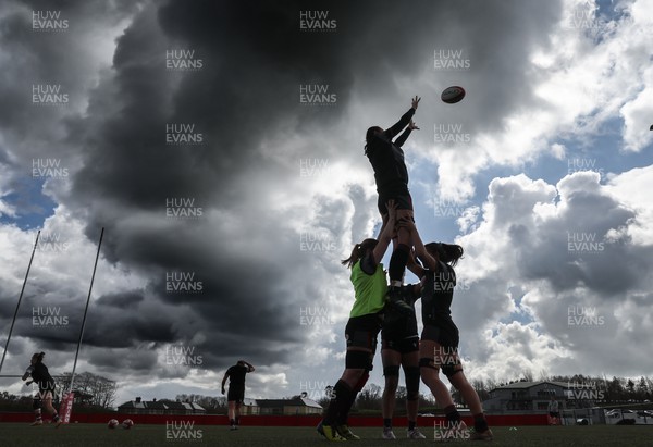 060423 -  Wales Women Rugby Squad - The Wales Women team go through line outs against a dramatic sky during a training session ahead of their TicTok Women’s 6 Nations match against England