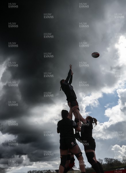 060423 -  Wales Women Rugby Squad - The Wales Women team go through line outs against a dramatic sky during a training session ahead of their TicTok Women’s 6 Nations match against England