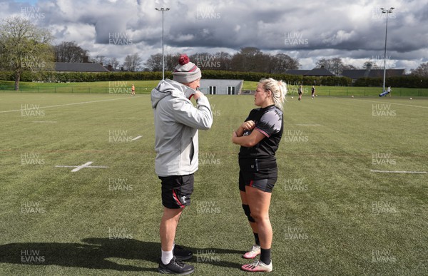 060423 -  Wales Women Rugby Squad - Kelsey Jones works with Wales assistant coach Mike Hill during a training session ahead of their TicTok Women’s 6 Nations match against England
