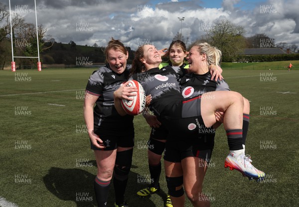 060423 -  Wales Women Rugby Squad - Kat Evans and Kelsey Jones, with Caryl Thomas and Bethan Lewis are all smiles at the end of a training session ahead of their TicTok Women’s 6 Nations match against England