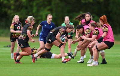 060526 - Wales Women Rugby Training Session - Natalia John takes on Sisilia Tuipulotu during training ahead of the 6 Nations match against Ireland
