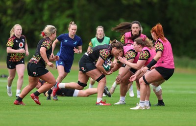 060526 - Wales Women Rugby Training Session - Natalia John takes on Sisilia Tuipulotu during training ahead of the 6 Nations match against Ireland