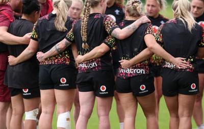 060526 - Wales Women Rugby Training Session - The Wales team huddle up during training ahead of the 6 Nations match against Ireland