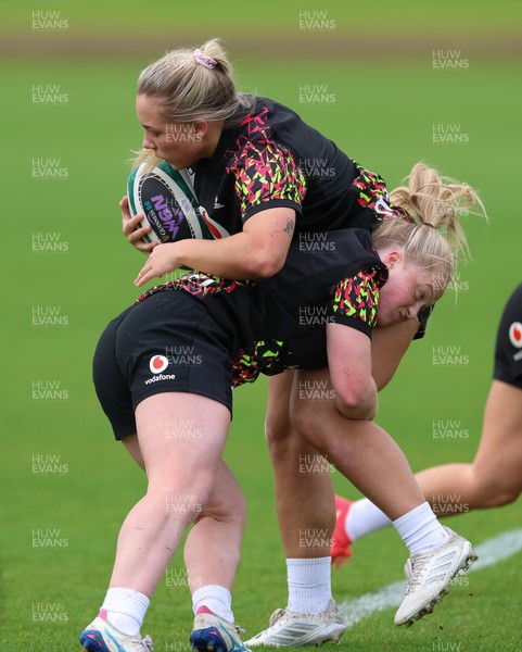 060526 - Wales Women Rugby Training Session - Kelsie Webster is tackled by Seren Lockwood during training ahead of the 6 Nations match against Ireland