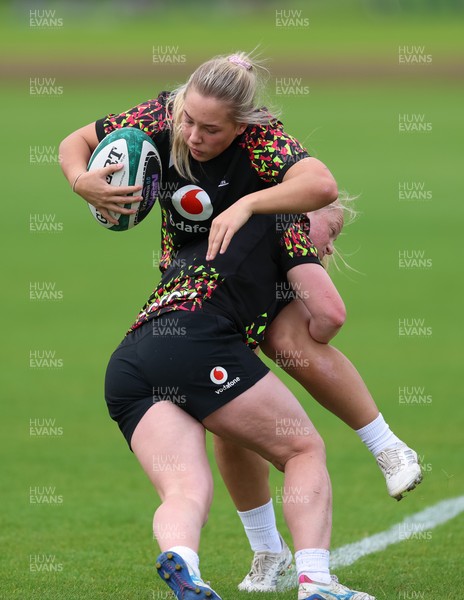 060526 - Wales Women Rugby Training Session - Kelsie Webster is tackled by Seren Lockwood during training ahead of the 6 Nations match against Ireland