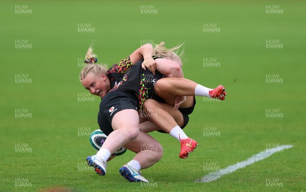 060526 - Wales Women Rugby Training Session - Seren Lockwood tackles Seren Singleton during training ahead of the 6 Nations match against Ireland