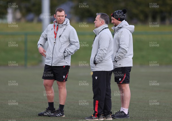 070323 - Wales Women Rugby Training Session - Head coach Ioan Cunningham, left,  attack coach Shaun Connor and defence coach  Mike Hill during training session